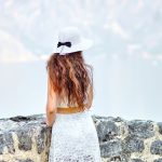 A woman, looking at the Kotor Bay from Our Lady of the Rocks island